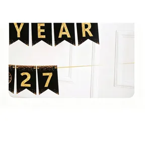Black gold party banner detail showcasing metallic glitter letters on black pennants.