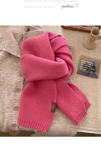 Cozy pink knitted winter scarf with soft wool texture, elegant and warm daily wear accessory.