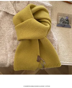 Korean style yellow knit scarf detail, soft wool-blend winter accessory with label accent.