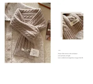 Nahaufnahme der Zopfmuster-Wollschal-Details mit strukturierter Textur und weichem Material.