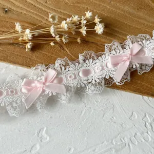 White lace trim with pink bows, pleated ruffle ribbon for DIY sewing and apparel decoration.