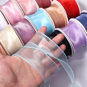 Sheer organza ribbon rolls in assorted vibrant colors for gift wrapping and DIY crafts.