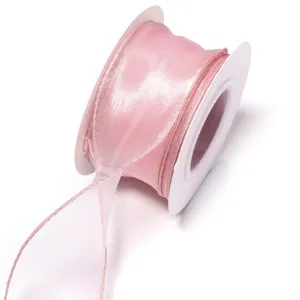 Pink sheer organza ribbon close up detail, lightweight fabric trim for DIY crafts and gifts.