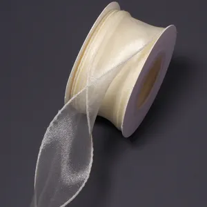 Detailed view of cream organza ribbon roll, delicate sheer texture for crafts and gift wrapping.