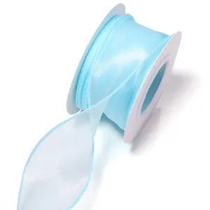 Light blue organza ribbon detail view, sheer fabric ribbon for gift wrapping and DIY crafts.