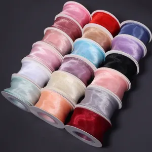 Multicolor organza ribbon rolls for gift wrapping, flower bouquets, and DIY craft projects.