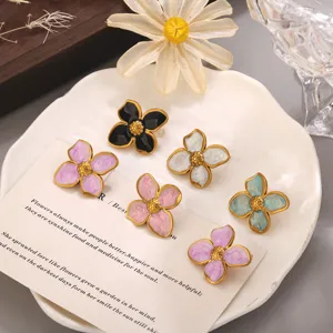 Stainless steel oil-drop four-petal flower earrings, vintage gold-edge floral jewelry accessory.