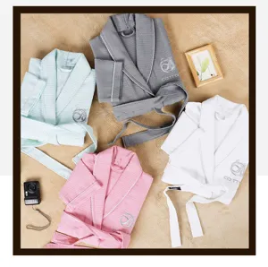 Detailed view of lightweight cotton waffle weave bathrobes in four assorted pastel colors.