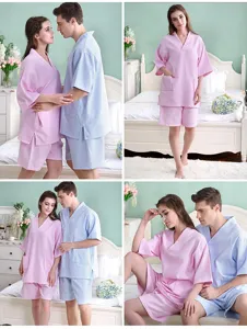 Detailed view of couple waffle weave sauna suits in pink and blue for hotel or home.