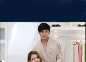 Close-up view of a couple wearing soft cotton bathrobes in a warm bedroom clothing display.