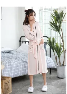 Pink bamboo fiber mid-length bathrobe for women with contrast black trim and tie belt