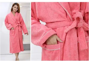 Comfortable pink cotton terry cloth bathrobe for women with belt, pockets and white piping.