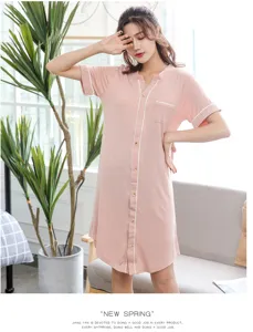 Pink short-sleeve button-down nightshirt lounge dress for women, comfortable sleepwear detail.