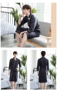Detail view of men's cotton bathrobe featuring contrast piping and belt for comfortable home wear.