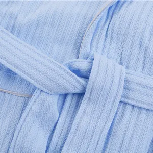 Light blue waffle knit cotton bathrobe with belt detail, perfect for cozy hotel sleepwear style.
