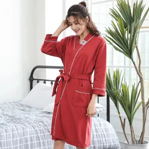 Comfortable cotton bathrobe for women, stylish red design with belt and pockets, perfect loungewear.