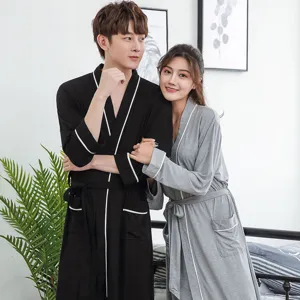 Couple bathrobes in black gray, long sleeves, waist belt, white piping, soft sleepwear.