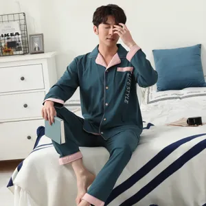 Men's long-sleeve cotton pajama set with contrast pink collar and cuffs for comfortable home wear.