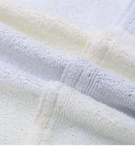 Microfiber fabric detail showing soft absorbent texture and neat looping loops for comfort.