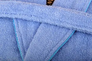 Blue cotton terry bathrobe detail view showcasing soft fabric texture and neat trim edging.