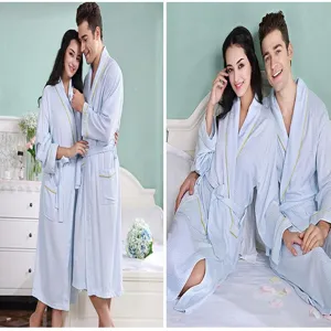 Details of the couple waffle bathrobe showing soft fabric texture and comfortable fit in bedroom.