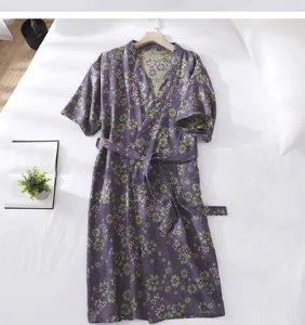 Detailed view of a purple floral cotton double-layer gauze bathrobe, soft and comfortable fabric.
