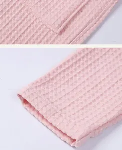 Pink waffle bathrobe fabric detail, soft cotton double layer texture cuffs and pocket.
