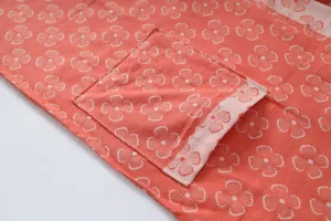 Pure cotton double layer gauze bathrobe detail view, soft breathable fabric with cute floral pattern.