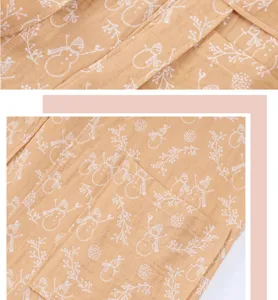 Cotton gauze bathrobe detail, soft breathable fabric with cute snowman print, ideal for home.