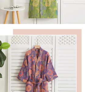Close-up detail of cotton gauze floral bathrobe, soft fabric, comfortable homewear detail view.