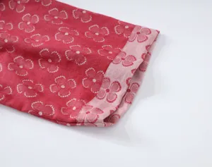 Soft cotton double gauze fabric cuff detail with red dotted floral print for sleepwear