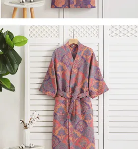 Cotton gauze bathrobe detailed view showcasing retro floral print, pocket and waist belt.