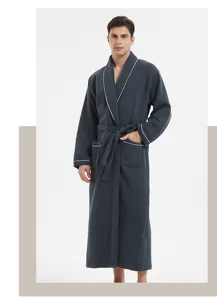 Detail view of men's long waffle bathrobe, dark grey with white piping and waist tie.