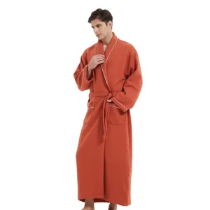 Men's long waffle weave bathrobe with white piping and belt for comfortable daily wear.