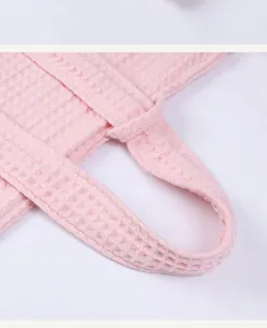 Waffle texture detail of the soft pink cotton bathrobe belt showcasing fine cotton quality.