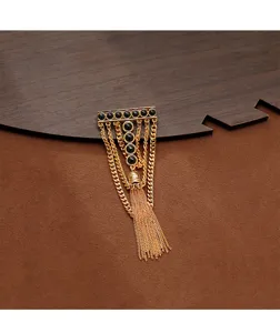 Detailed view of a retro T-shaped metal brooch featuring black stone accents and long golden chains.