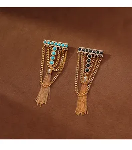 Close-up of vintage geometric turquoise and black onyx tassel brooch, exquisite retro design.