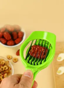 Multifunctional kitchen fruit slicer tool detail showing stainless steel blades for easy slicing.