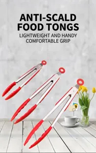 Stainless steel food tongs with red silicone anti-slip grips for kitchen cooking and baking detail.