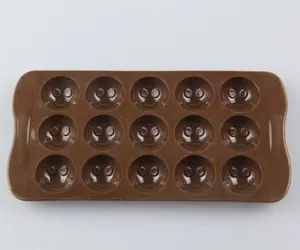 Silicone chocolate mold detail showing 15 cute smiley face cavities for baking and ice making.