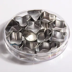 Stainless steel cookie cutter set with various animal and geometric shapes in a clear box.