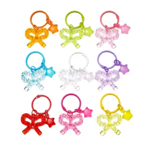 Colorful transparent acrylic bow keychain with star pendant dopamin style bag accessory.