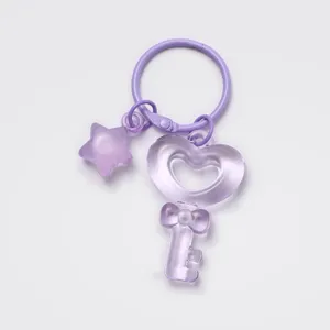 Purple translucent heart key and star keychain, cute jelly style DIY accessory charm.