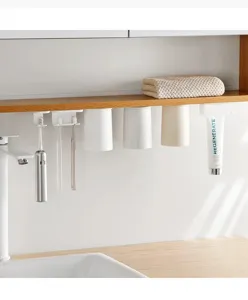 Wandmontage magnetische tandenborstelhouder met omgekeerde bekers en tandpastaknijper voor badkamer.