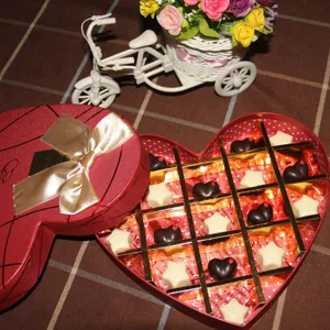 Heart-shaped chocolate gift box with assorted star and heart chocolates for sweet romantic gifts.