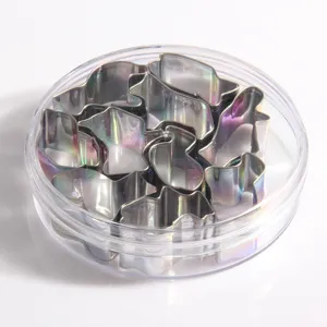 Stainless steel cookie cutters detail view, featuring various shapes inside clear case.