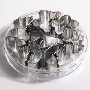 Stainless steel cookie cutter set in transparent round box, perfect for baking biscuits and pastry.