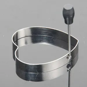 Stainless steel heart-shaped egg ring mold for breakfast cooking, durable and easy to clean use.