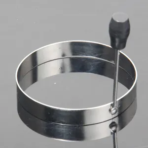 Stainless steel egg ring cooking mold detail shot, practical kitchen tool for fried eggs and pancakes.