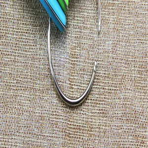 Stainless steel measuring spoon ring with colorful silicone handle kitchen tool detail view.